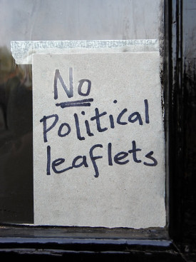A hand-written sign that reads 'No Political Leaflets'.